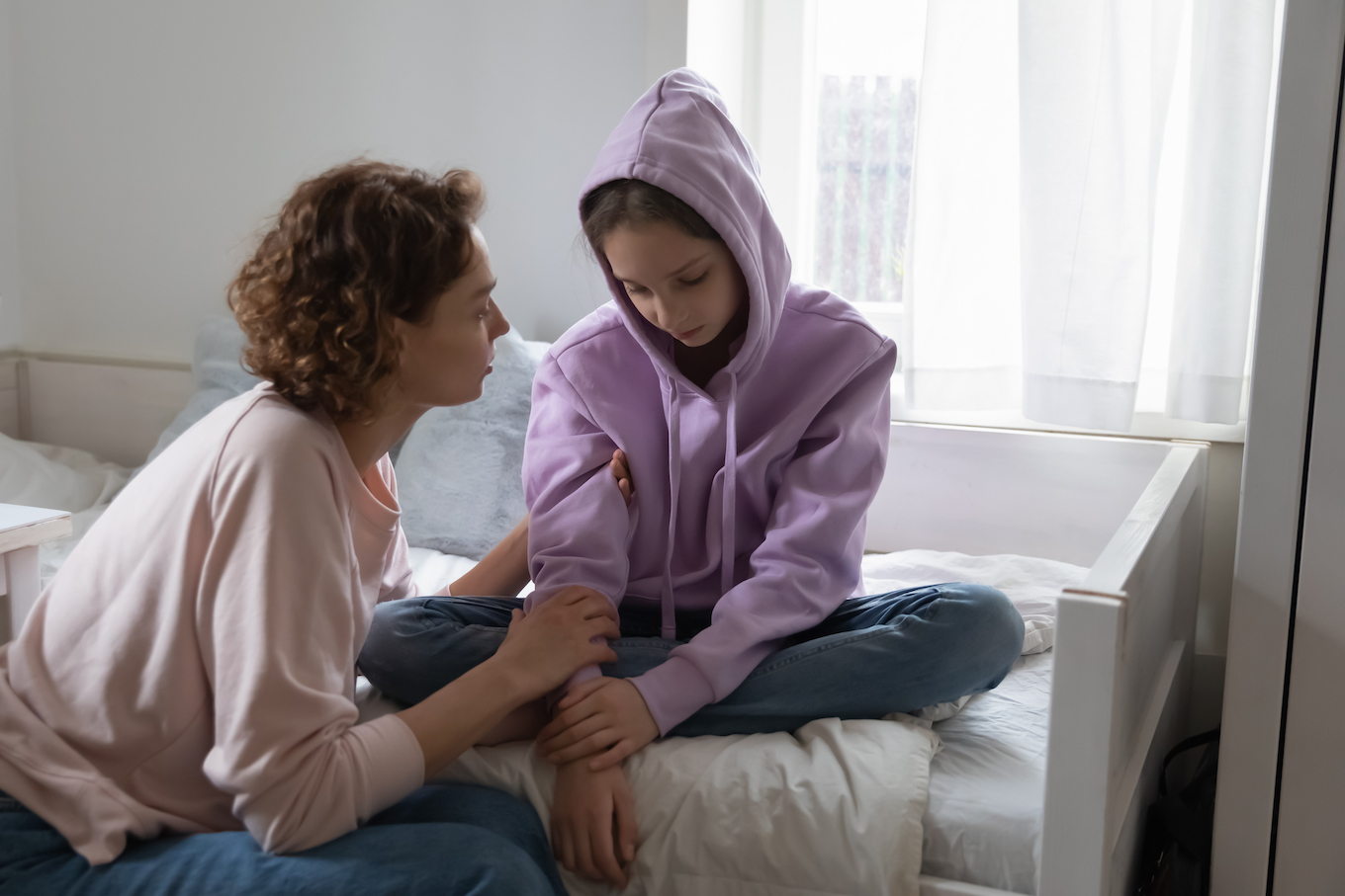 Mom talking to daughter