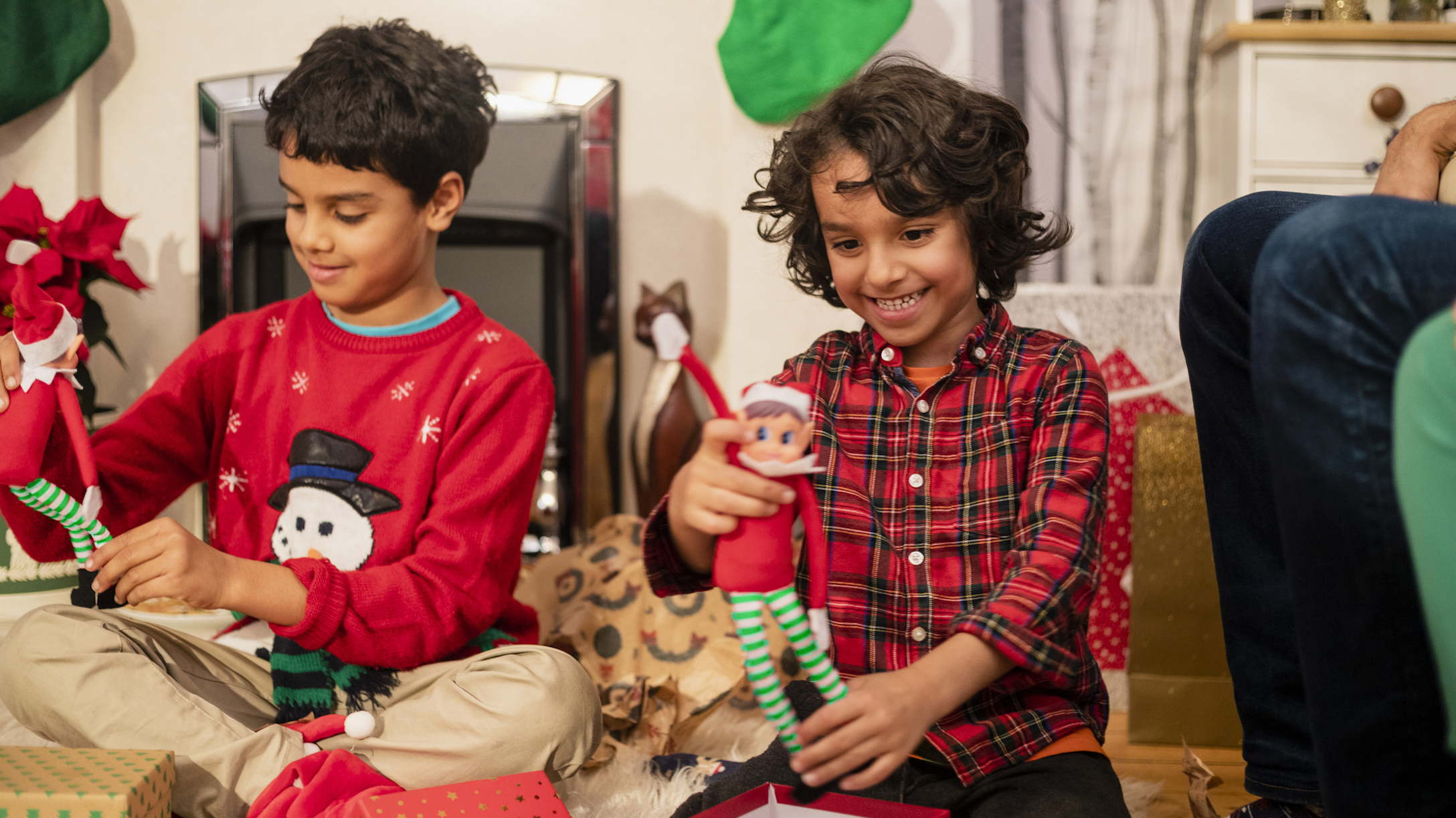 Kids playing with an elf toy