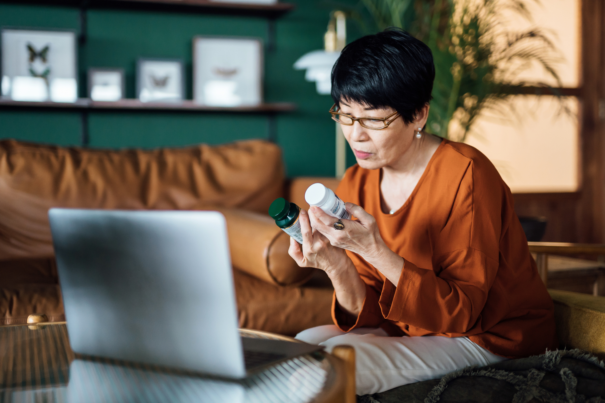 Senior Asian woman having a virtual appointment with doctor online