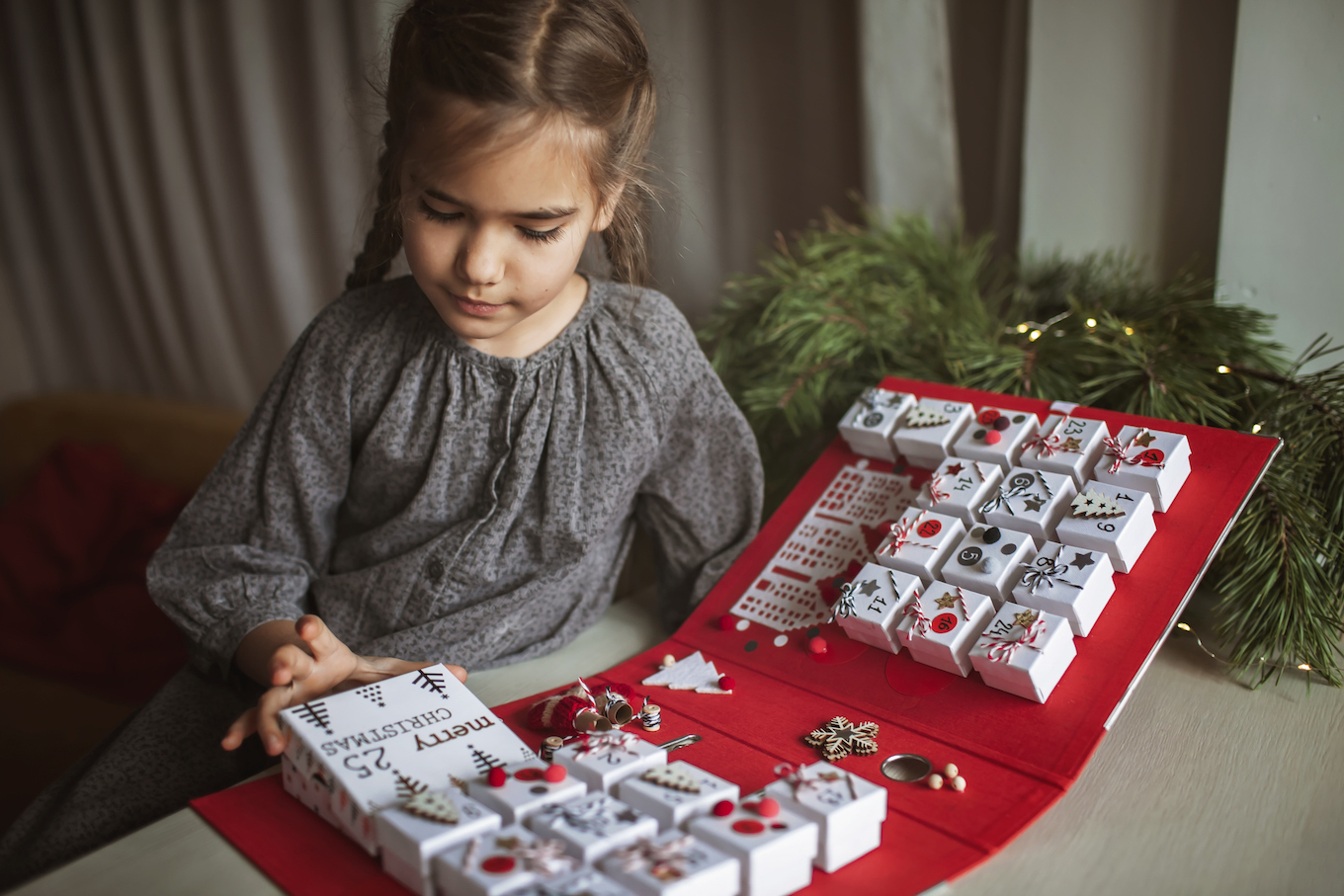 Girl opens an advent calendar
