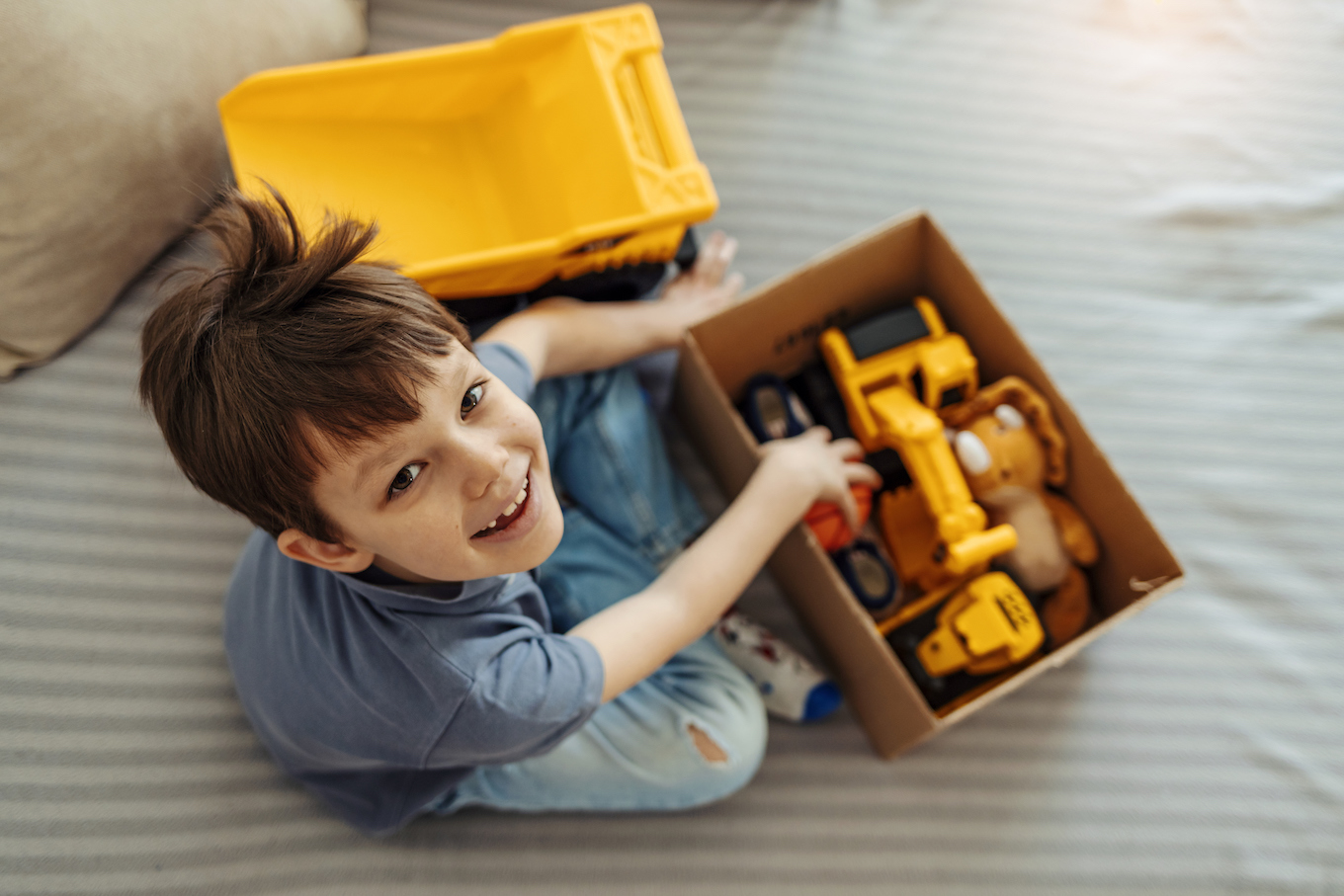 Happy child with toy box