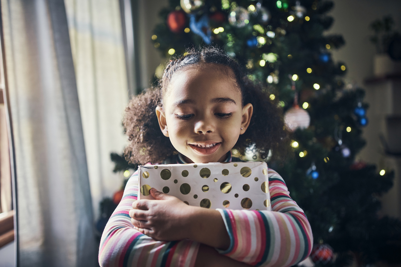 Girl holding a gift box