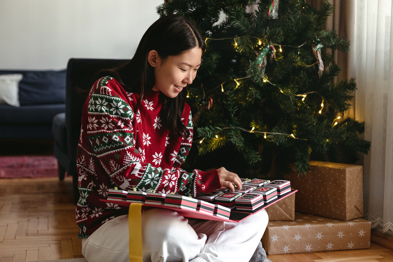 Woman opening an advent calendar