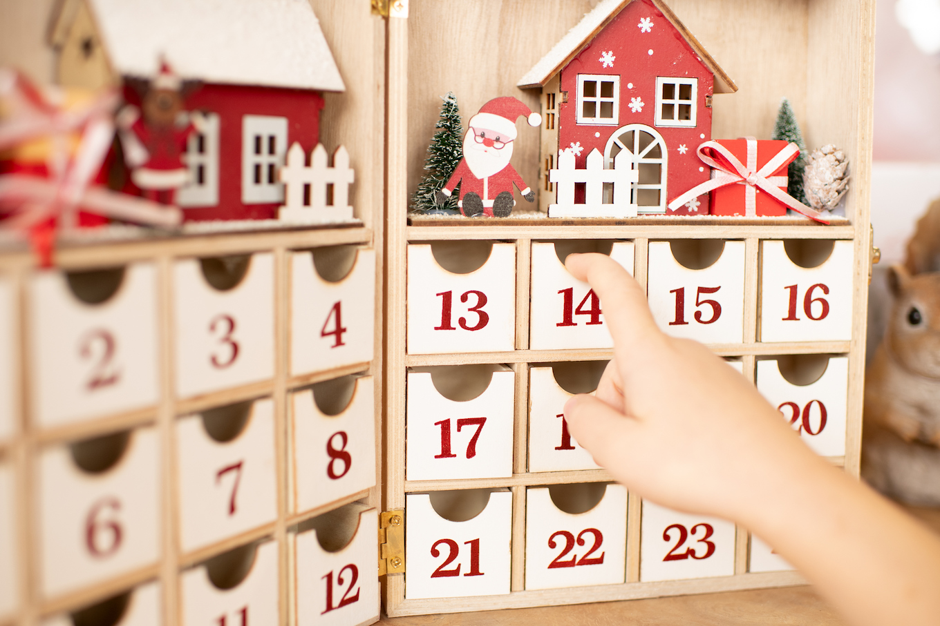 hand opening an advent calendar