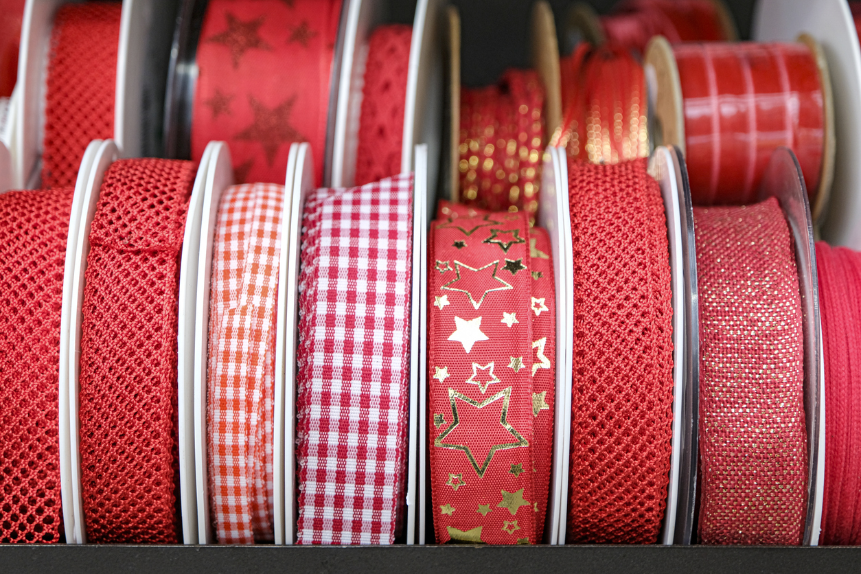 Decorative Christmas ribbons are used to wrap Christmas presents.