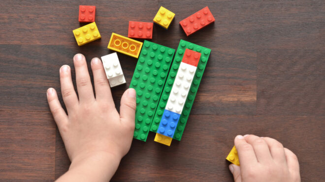 Child playing with Lego bricks