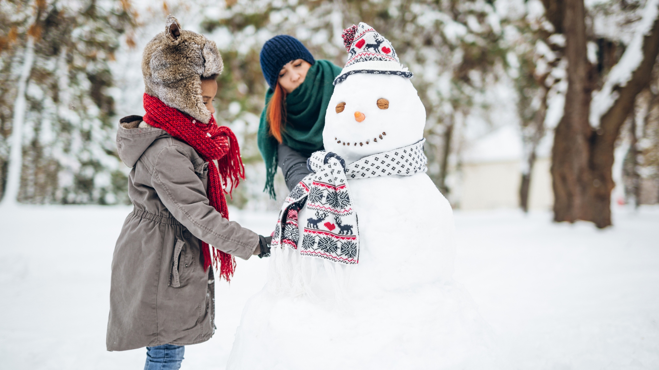 Kids build a snowman