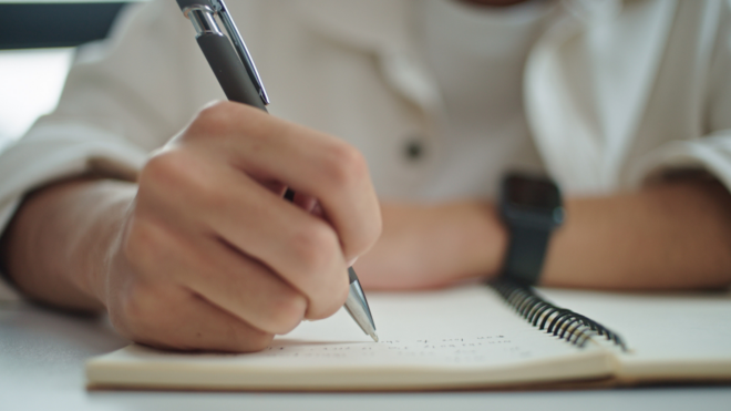 teen boy writing